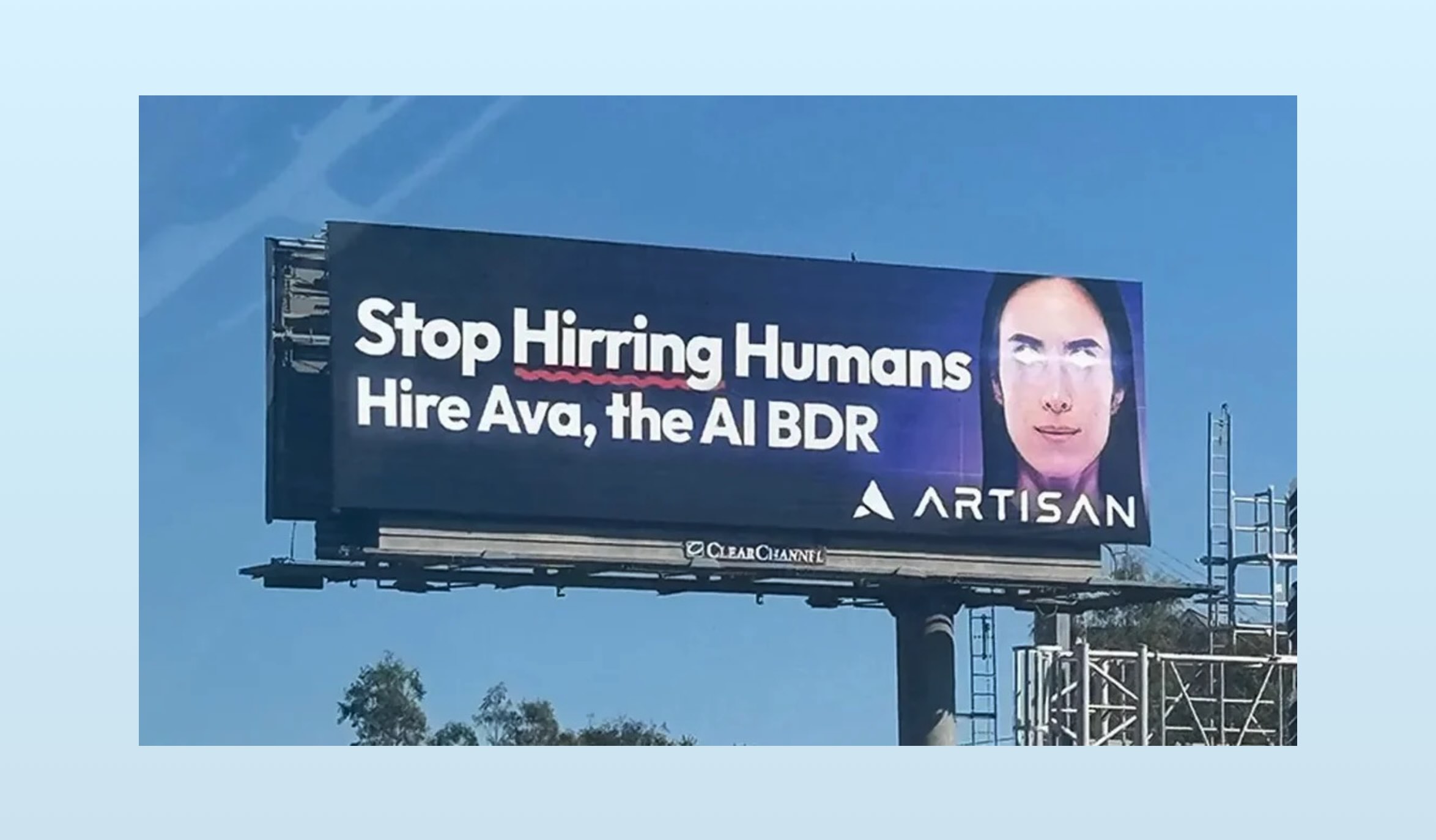A billboard in San Francisco saying you should stop hiring humans.